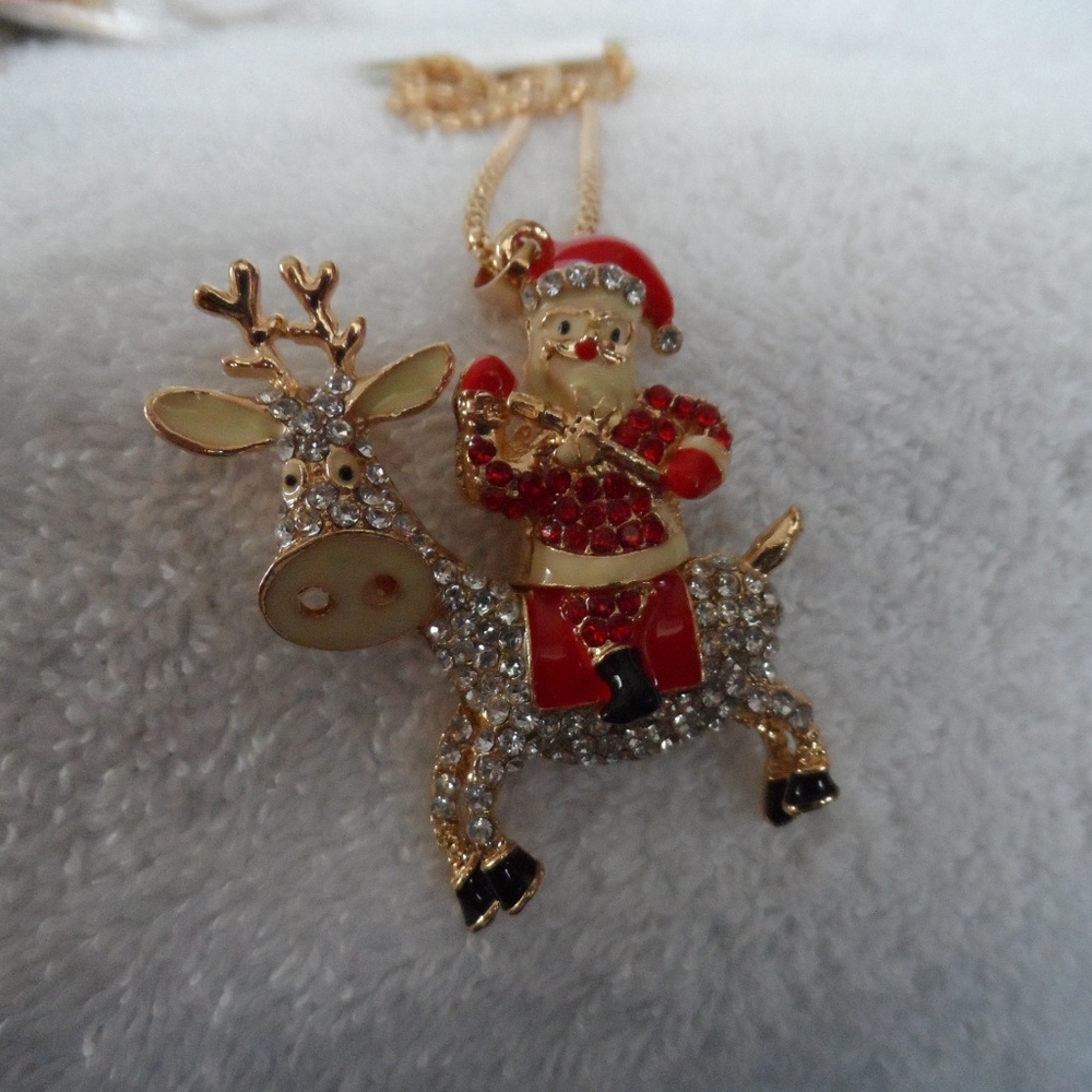 crystal Santa riding a reindeer pendant necklace